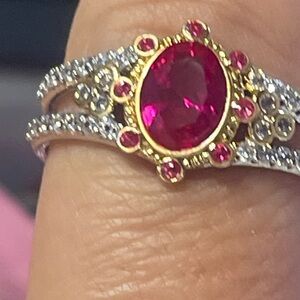 Elegant Gold and Silver Ring with Red Gemstones